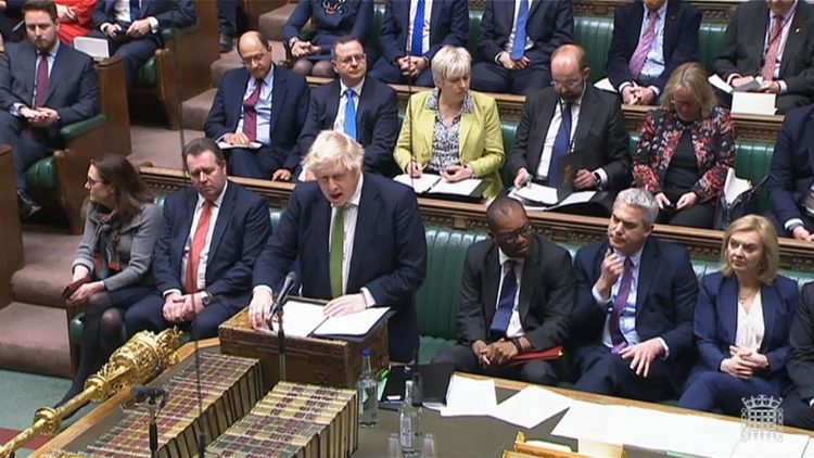 A video grab from footage broadcast by the UK Parliament's Parliamentary Recording Unit (PRU) shows Britain's Prime Minister Boris Johnson speaking as he updates MPs on the situation in Ukraine and sanctions to be made against Russia, in the House of Commons, in London, on February 22, 2022. - Britain on Tuesday vowed to "hit Russia very hard" with targeted sanctions and promised tougher measures in the event of a full-scale invasion, after the Kremlin ordered troops into two Moscow-backed rebel regions of Ukraine. (Photo by various sources / AFP) / RESTRICTED TO EDITORIAL USE - MANDATORY CREDIT "AFP PHOTO / PRU " - NO MARKETING - NO ADVERTISING CAMPAIGNS - DISTRIBUTED AS A SERVICE TO CLIENTS