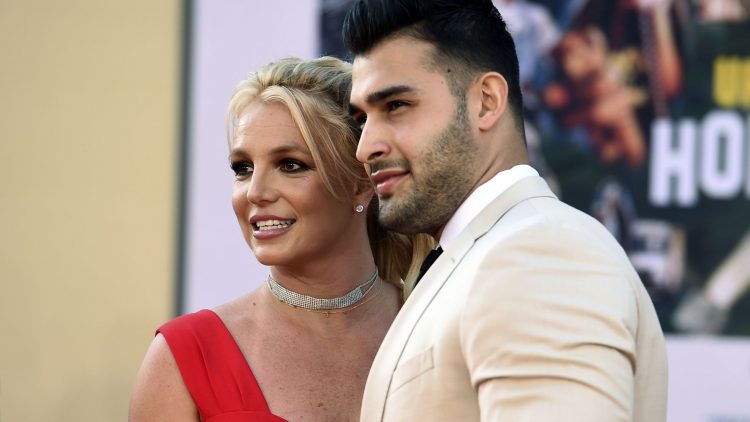 Britney Spears and Sam Asghari arrive at the Los Angeles premiere of "Once Upon a Time in Hollywood," at the TCL Chinese Theatre, Monday, July 22, 2019. Spears announced on Instagram on Sunday, Sept. 12, 2021, that she and Asghari are engaged. The couple met on the set of her “Slumber Party” music video in 2016. (Photo by Jordan Strauss/Invision/AP, File)