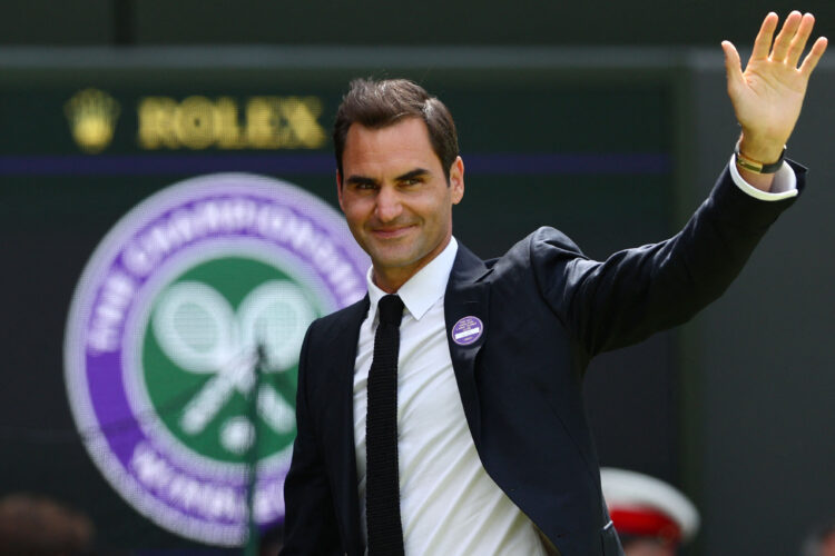 Swiss tennis player Roger Federer waves during the Centre Court Centenary Ceremony, on the seventh day of the 2022 Wimbledon Championships at The All England Tennis Club in Wimbledon, southwest London, on July 3, 2022. (Photo by Adrian DENNIS / AFP) / RESTRICTED TO EDITORIAL USE / The erroneous mention[s] appearing in the metadata of this photo by Adrian DENNIS has been modified in AFP systems in the following manner: [Swiss tennis player Roger Federer] instead of [Swiss former tennis player Roger Federer]. Please immediately remove the erroneous mention[s] from all your online services and delete it (them) from your servers. If you have been authorized by AFP to distribute it (them) to third parties, please ensure that the same actions are carried out by them. Failure to promptly comply with these instructions will entail liability on your part for any continued or post notification usage. Therefore we thank you very much for all your attention and prompt action. We are sorry for the inconvenience this notification may cause and remain at your disposal for any further information you may require.
