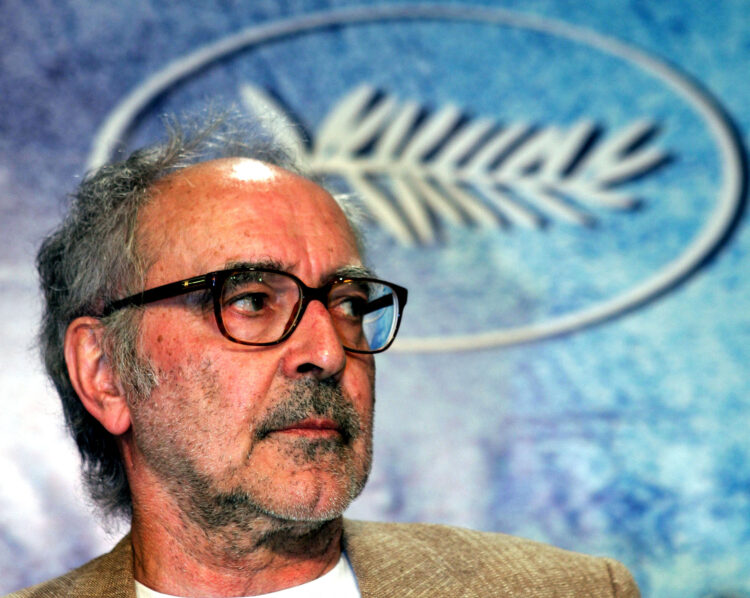 FILE PHOTO: Swiss director Jean-Luc Godard listens to question during a press conference for his film entry 'Notre Musique' which is screened out of competition at the 57th Cannes Film Festival, May 18, 2004. REUTERS/Vincent Kessler/File Photo