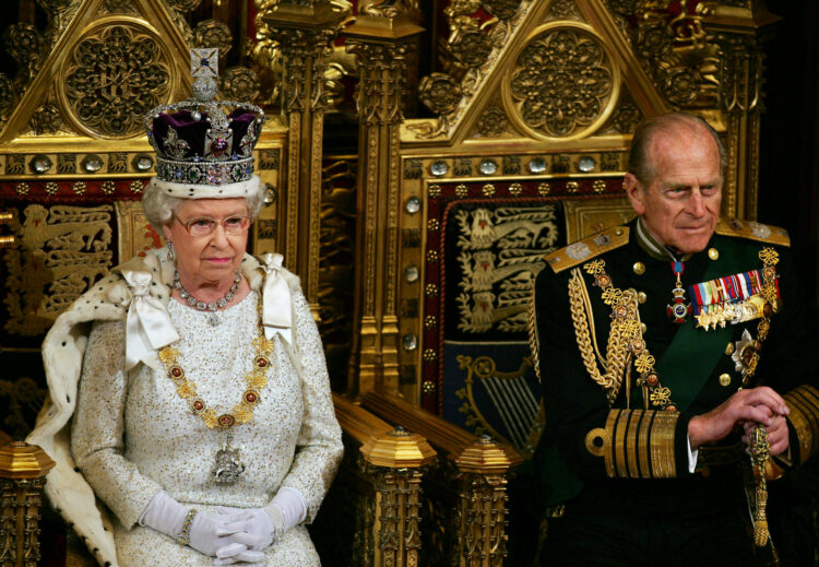 Britiain's Queen Elizabeth II (L) and Prince Philip wait to address politicians at the 'State Opening Of Parliament' in London, 15 November 2006. The British government will publish a long-awaited bill on tackling climate change in the forthcoming session of parliament, Queen Elizabeth II announced Wednesday. One of the key tenets of Prime Minister Tony Blair's final few months in office will therefore involve attempting to set a legacy on slowing global warming -- which his Downing Street office has branded "the biggest long-term threat that we now face."  /WPA POOL/ (Photo by Adrian DENNIS / POOL / AFP)