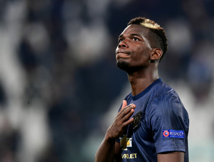(FILES) In this file photo taken on November 07, 2018 Manchester United's French midfielder Paul Pogba acknowledges the public at the end of the UEFA Champions League group H football match Juventus vs Manchester United at the Allianz stadium in Turin. Paul Pogba will miss the upcoming World Cup for France as he needs more time to recover from knee surgery, his agent announced on October 31, 2022. (Photo by Miguel MEDINA / AFP)