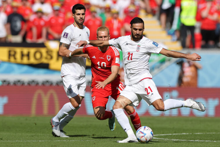 Iran's midfielder #21 Ahmad Noorollahi kicks the ball during the Qatar 2022 World Cup Group B football match between Wales and Iran at the Ahmad Bin Ali Stadium in Al-Rayyan, west of Doha on November 25, 2022. (Photo by FADEL SENNA / AFP)