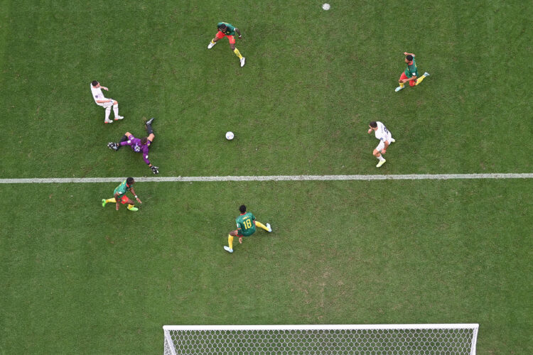 Serbia's midfielder #14 Andrija Zivkovic (top L) passes the ball to Serbia's forward #09 Aleksandar Mitrovic (middle R) to score their team's third goal during the Qatar 2022 World Cup Group G football match between Cameroon and Serbia at the Al-Janoub Stadium in Al-Wakrah, south of Doha on November 28, 2022. (Photo by Antonin THUILLIER / AFP)