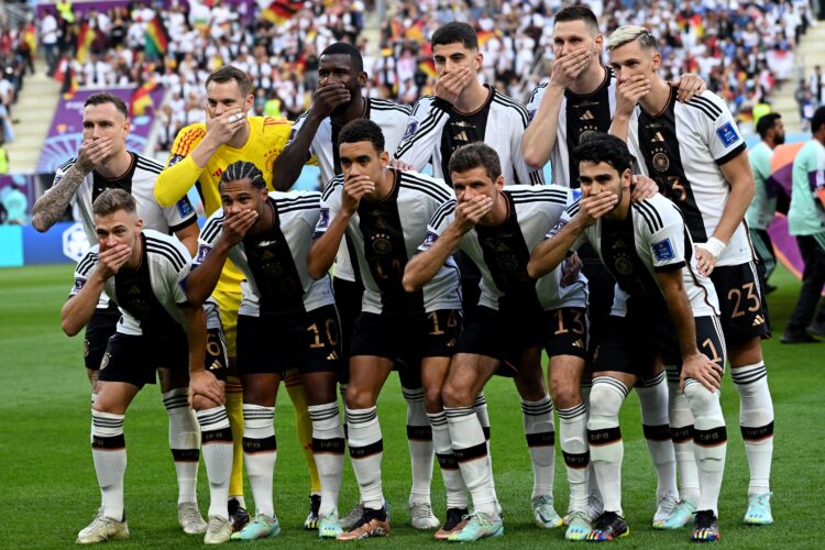 Players of Germany gesture as they pose for the group picture ahead of the Qatar 2022 World Cup Group E football match between Germany and Japan at the Khalifa International Stadium in Doha on November 23, 2022. (Photo by Ina Fassbender / AFP)