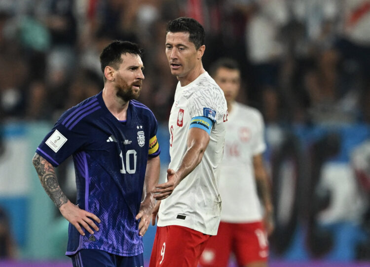 Soccer Football - FIFA World Cup Qatar 2022 - Group C - Poland v Argentina - Stadium 974, Doha, Qatar - November 30, 2022 Poland's Robert Lewandowski and Argentina's Lionel Messi REUTERS/Dylan Martinez