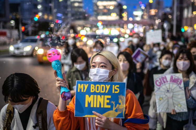 People take part in an International Women's Day rally in Tokyo on March 8, 2023. (Photo by Philip FONG / AFP)