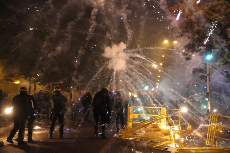 Police forces clash with youths in Nanterre, outside Paris, Thursday, June 29, 2023. The death of 17-year-old Nael by police during a traffic check Tuesday in the Paris suburb of Nanterre elicited nationwide concern and widespread messages of indignation and condolences. Interior Minister Gerald Darmanin said 1,200 police were deployed overnight and 2,000 would be out in force Wednesday in the Paris region and around other big cities to "maintain order."(AP Photo/Christophe Ena)